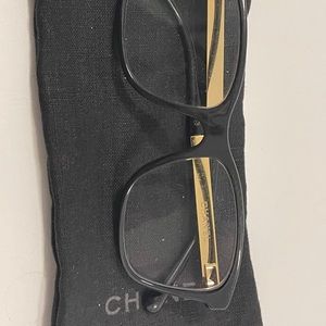 Eyeglass frames by Chanel. Black and Gold.